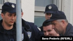 Duško Šarić u pratnji policije, 13. mja 2011