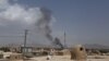 Taliban, Afghan Forces 'Continue To Battle' For Key City