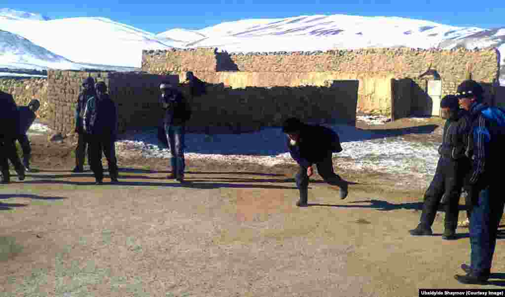 Tajikistan -- Abdilaat Ibraev and others play Ashyk/Chuko/Ankle Bone Shooting, Murghab, 24 December 2014