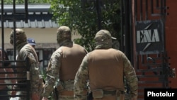 Armenia - Masked law-enforcement officers raid the headquarters of Electric Networks of Armenia (ENA), July 8, 2025.