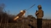 FILE PHOTO: Ukrainian servicemen fire a Grad MLRS towards Russian troops near the frontline town of Pokrovsk
